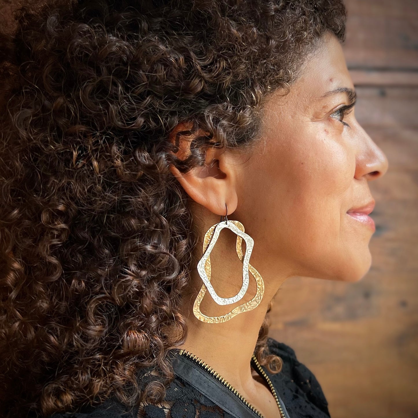 These gorgeous, handcrafted Canyon Earrings, feature overlapping, textured bronze and sterling silver pieces. The asymmetrical pair are striking, comfortable and have beautiful movement. These unique pieces are made to order and can take up to one week to ship. Clean regularly with polishing pad or soft cloth and mild soap. Consciously made in New York.