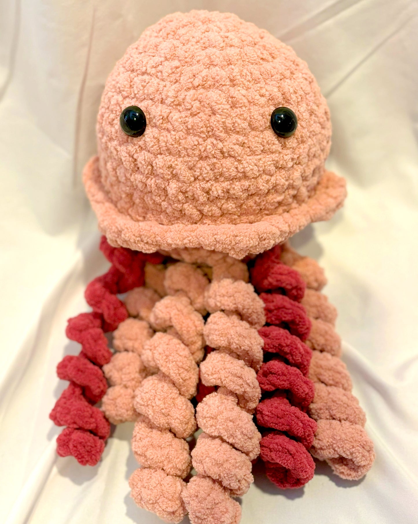 Adorable crochet Jellyfish plushie collectibles are hand crafted by Anya, MarVia Square's youngest artisan. Made with the softest acrylic yarn. If there is a specific color combination you would like, it can be custom made upon request. Dimensions: 6" wide, 12.5" high Hand wash or dry clean only Consciously made in California