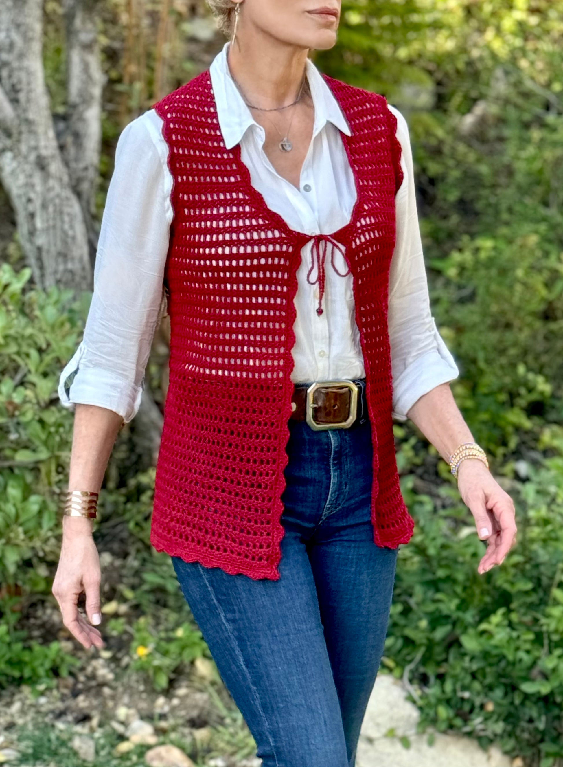 Obsessed with this tie front, scalloped edge, open crochet vest in crimson. Hand crocheted with high quality, good stretch, acrylic yarn, that will fit petite, small and medium sizes. One Size Hand wash cold, Line dry or Dry clean Consciously made in the USA