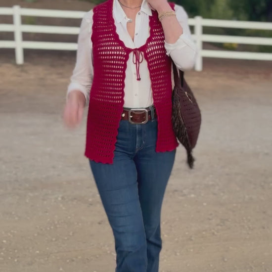 Obsessed with this tie front, scalloped edge, open crochet vest in crimson. Hand crocheted with high quality, good stretch, acrylic yarn, that will fit petite, small and medium sizes. One Size Hand wash cold, Line dry or Dry clean Consciously made in the USA