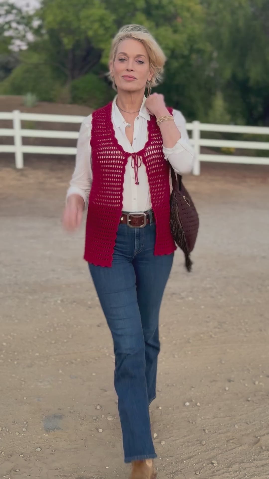 Obsessed with this tie front, scalloped edge, open crochet vest in crimson. Hand crocheted with high quality, good stretch, acrylic yarn, that will fit petite, small and medium sizes. One Size Hand wash cold, Line dry or Dry clean Consciously made in the USA